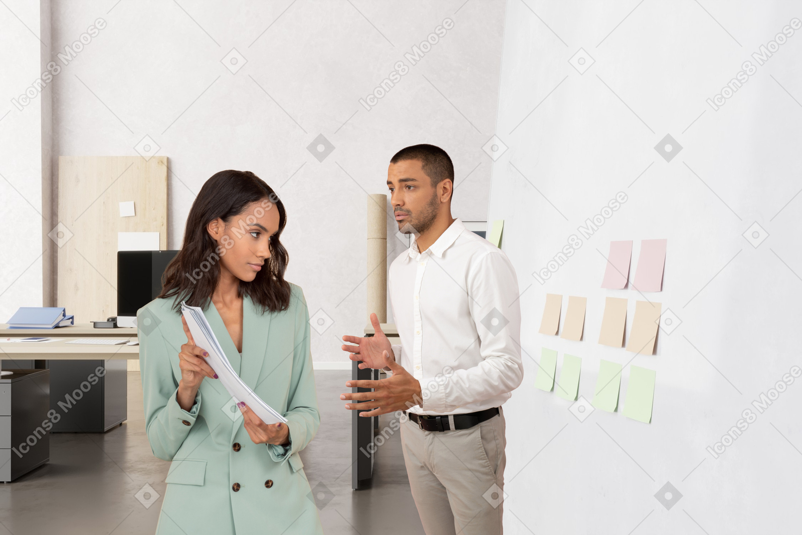 Woman showing report to her colleague