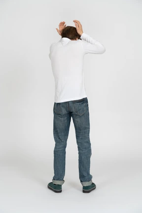 Young man in casual clothes standing