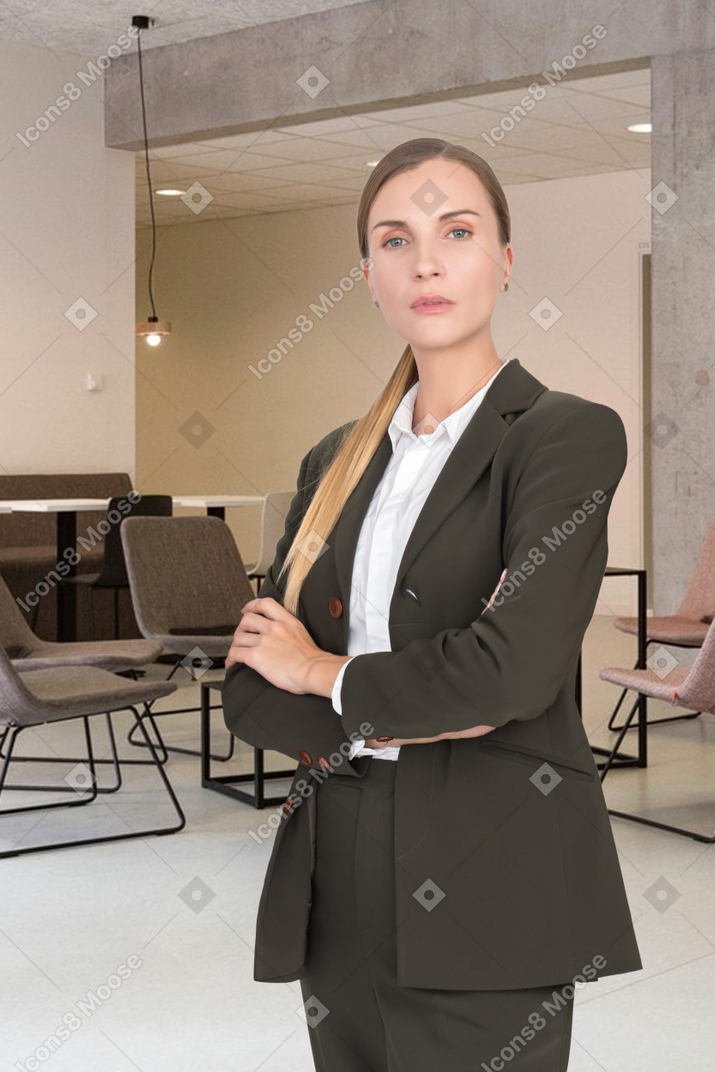 A woman in a suit standing in a room
