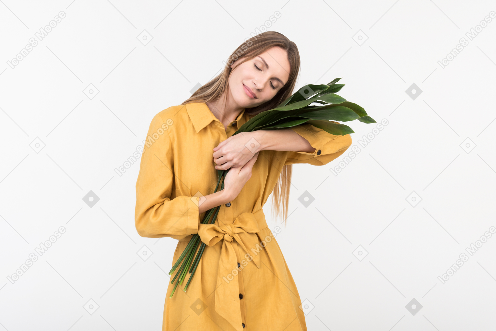 Young woman holding branch tenderly like a child