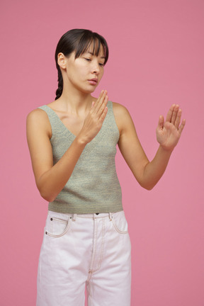 Young woman looking at her hands