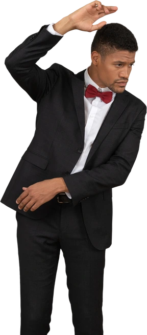 Man in black suit standing