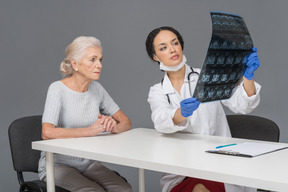 Elder woman consulting with her doctor about test results