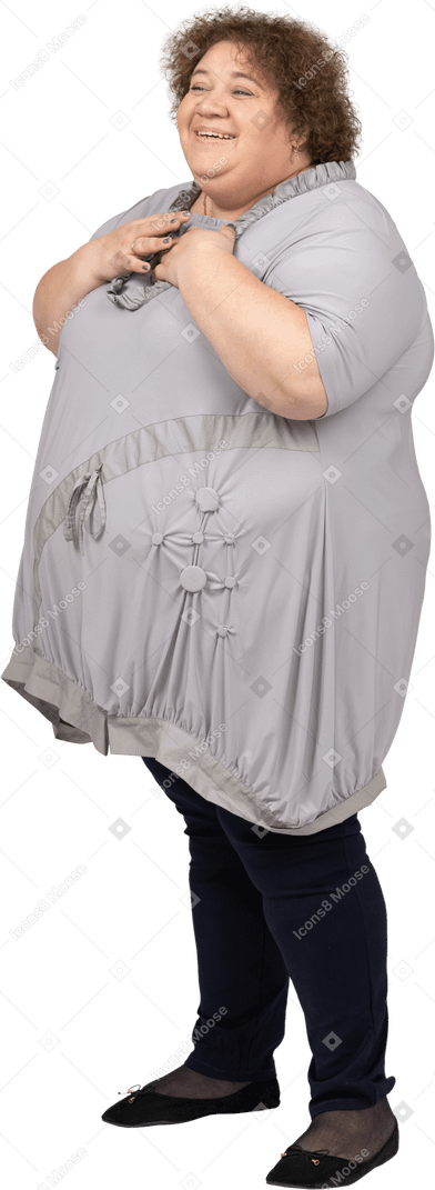 Smiling woman with hands on her chest