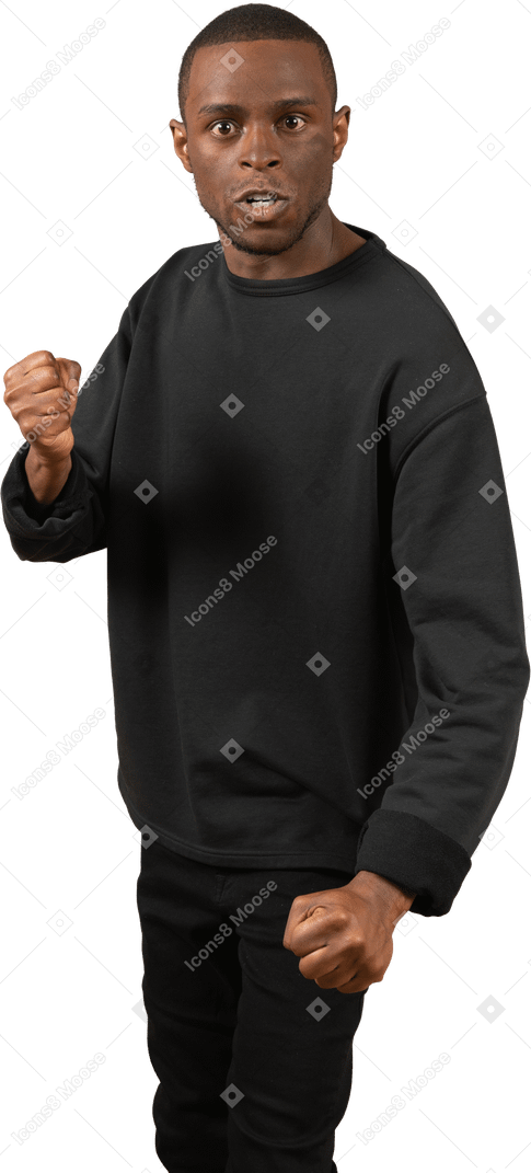 Angry man threatening to punch with fist