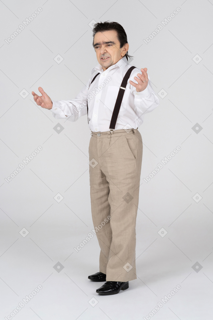 Middle-aged man talking with spread arms