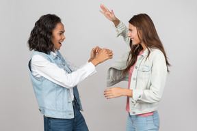 Friends playing rock-paper-scissors