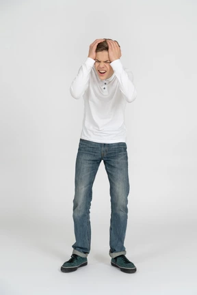 Young man in casual clothes standing