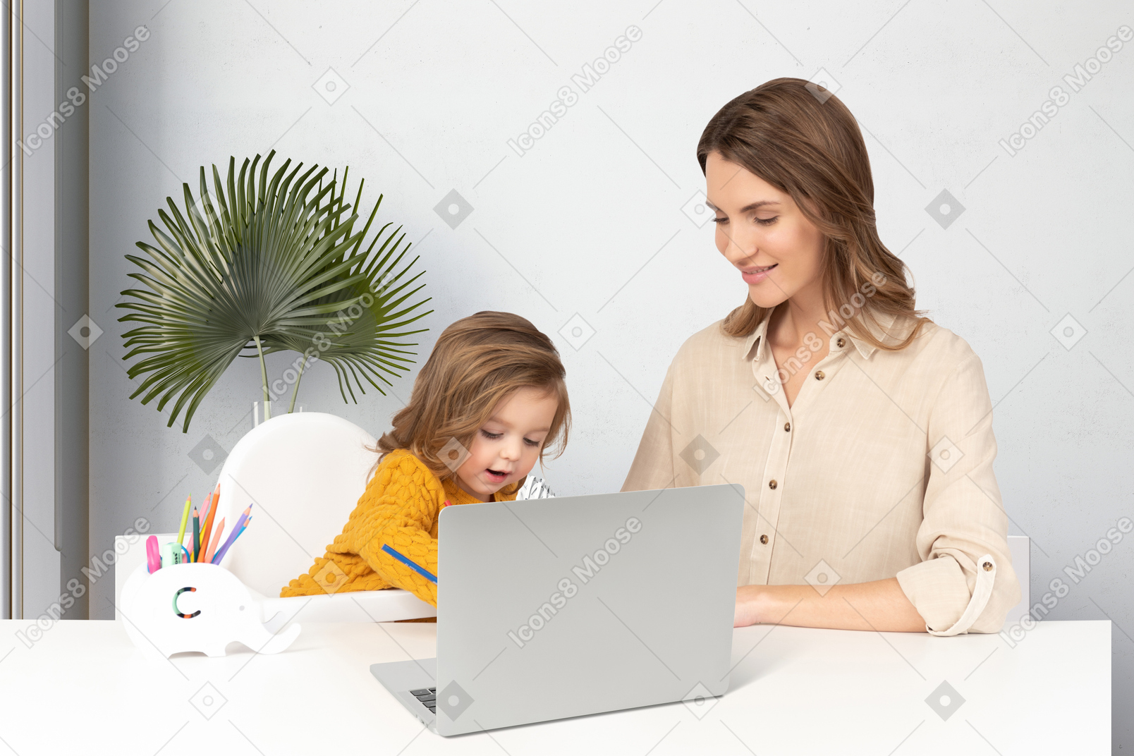 A woman and a little girl looking at a laptop
