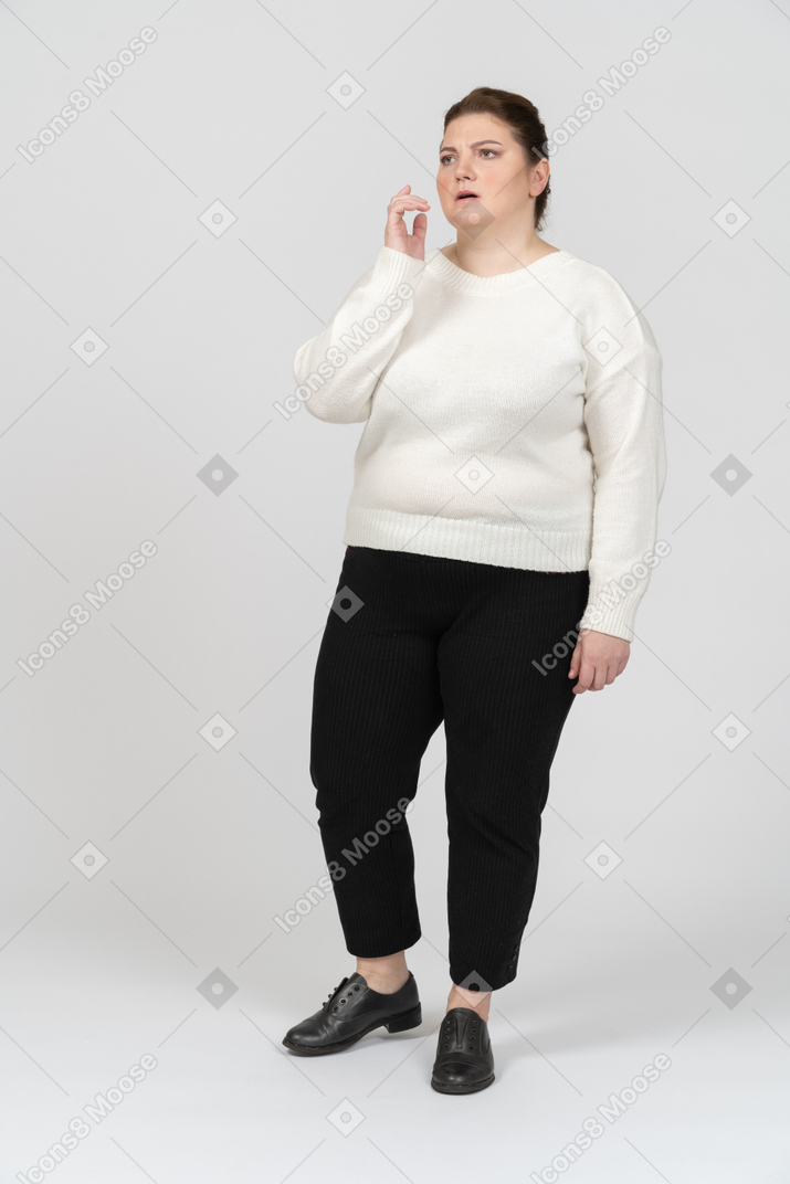 Thoughtful plump woman in casual clothes