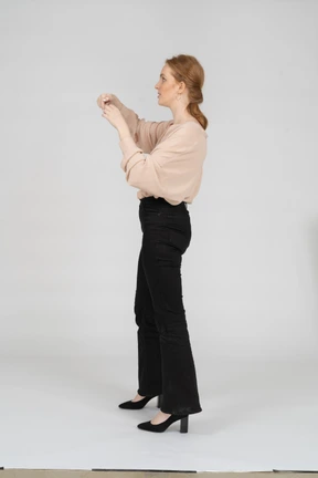 Woman in beautiful blouse standing