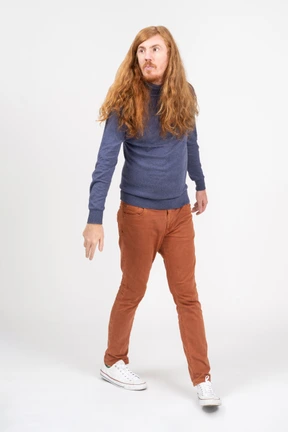 Front view of a young man in casual clothes walking forward