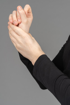 Side view of hands hands being sanitized