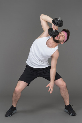 Man lifting a dumbbell on its last legs