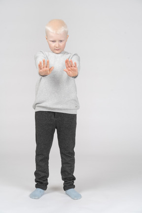 Little boy with both arms outstretched