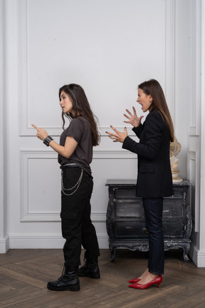 Two women scolding someone