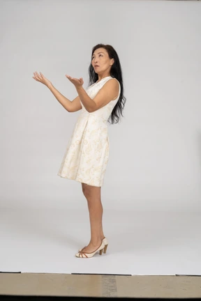 Woman in a white dress standing