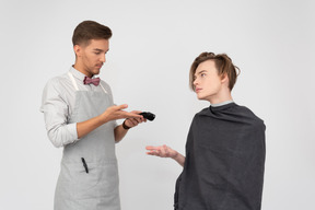 A young barber and his client