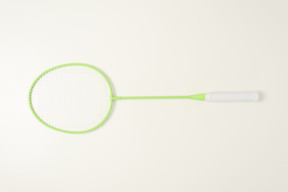 Green tennis racket on a white background