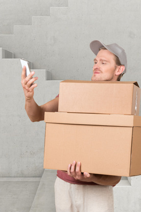 A delivery man holding boxes