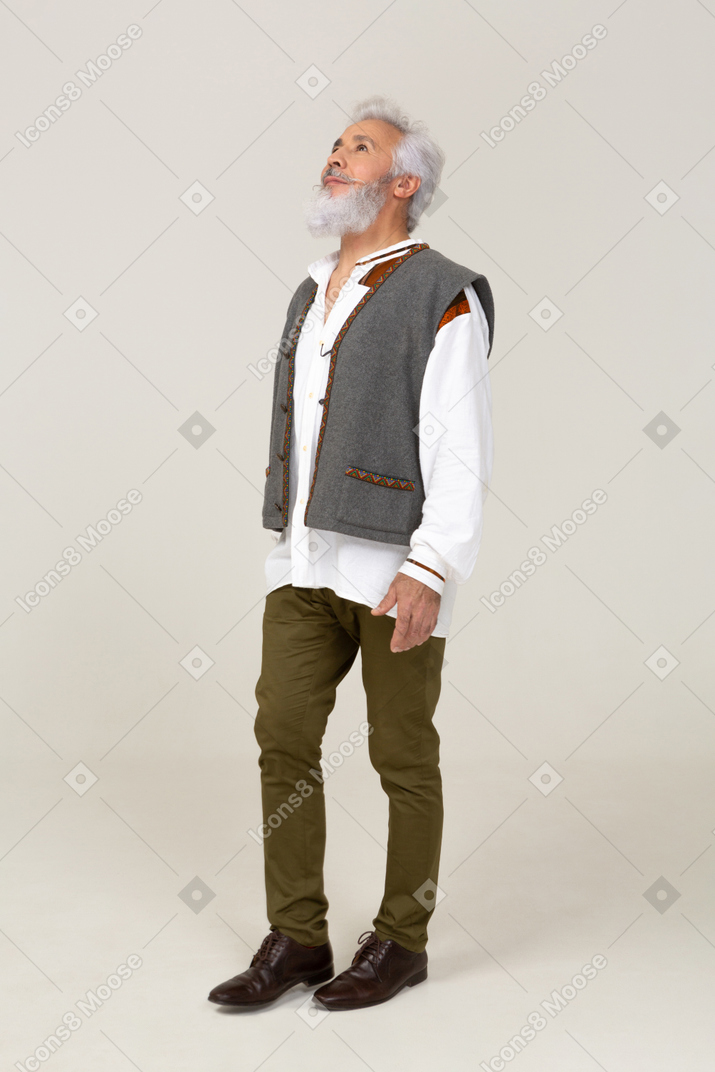 Hopeful man in casual clothes standing still