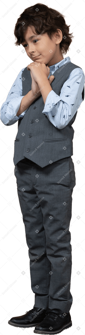 Front view of a cute boy in grey suit