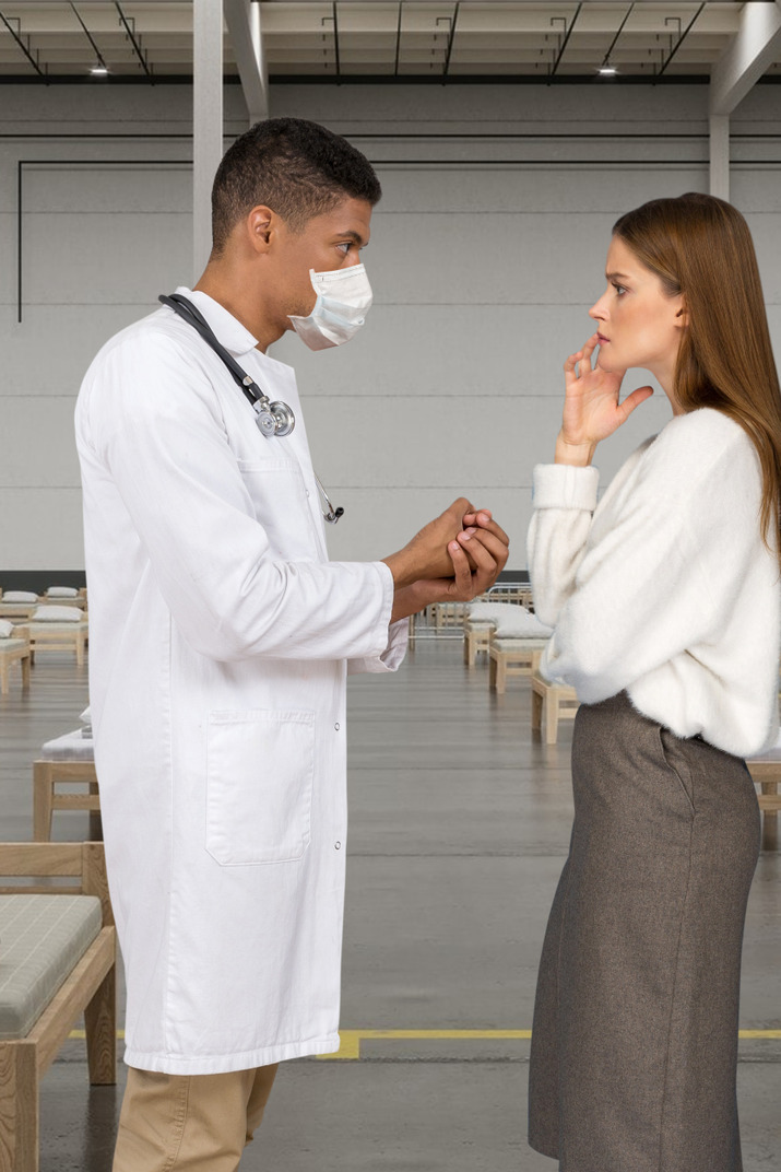 Man doctor talking to a woman