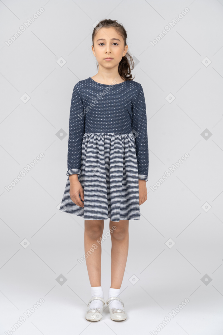 Front view of a girl standing straight