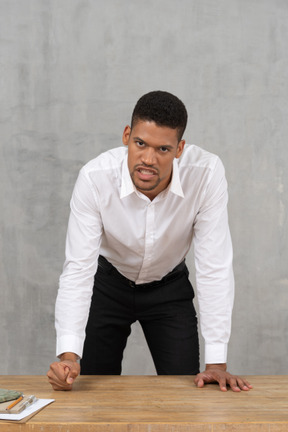 Angry man punching the table