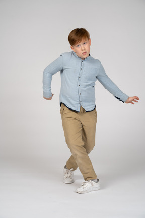 A young boy doing dance moves