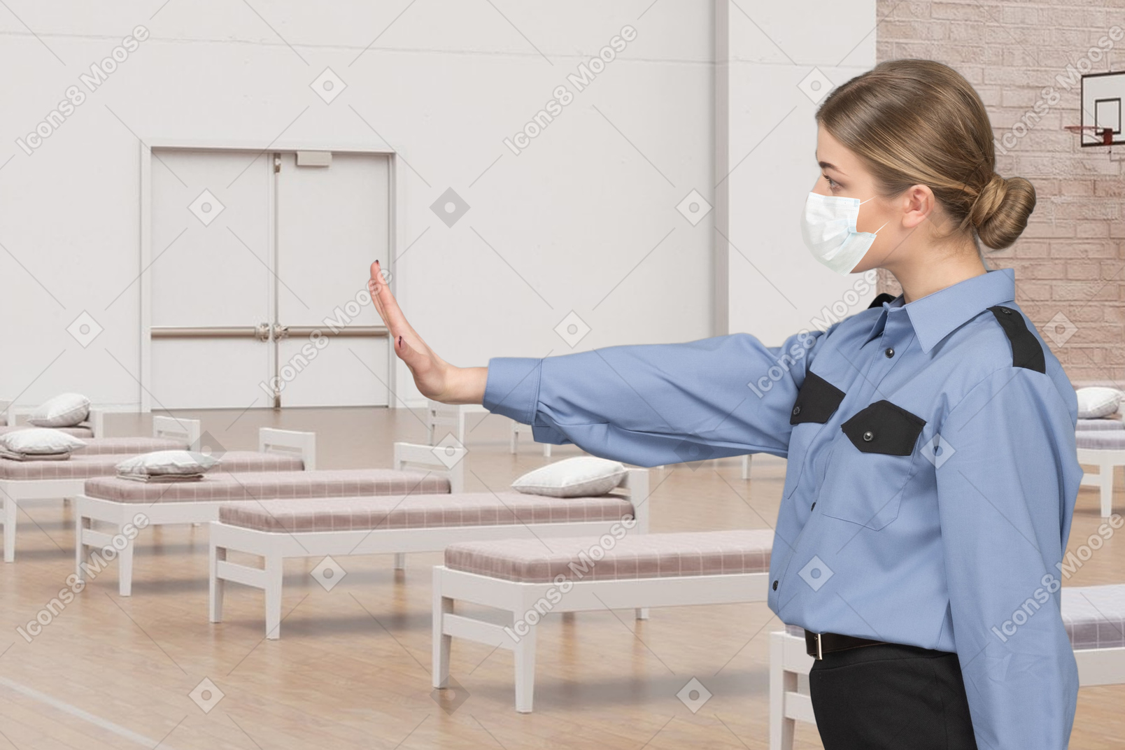 Female police officer showing stop hand gesture in a room with beds