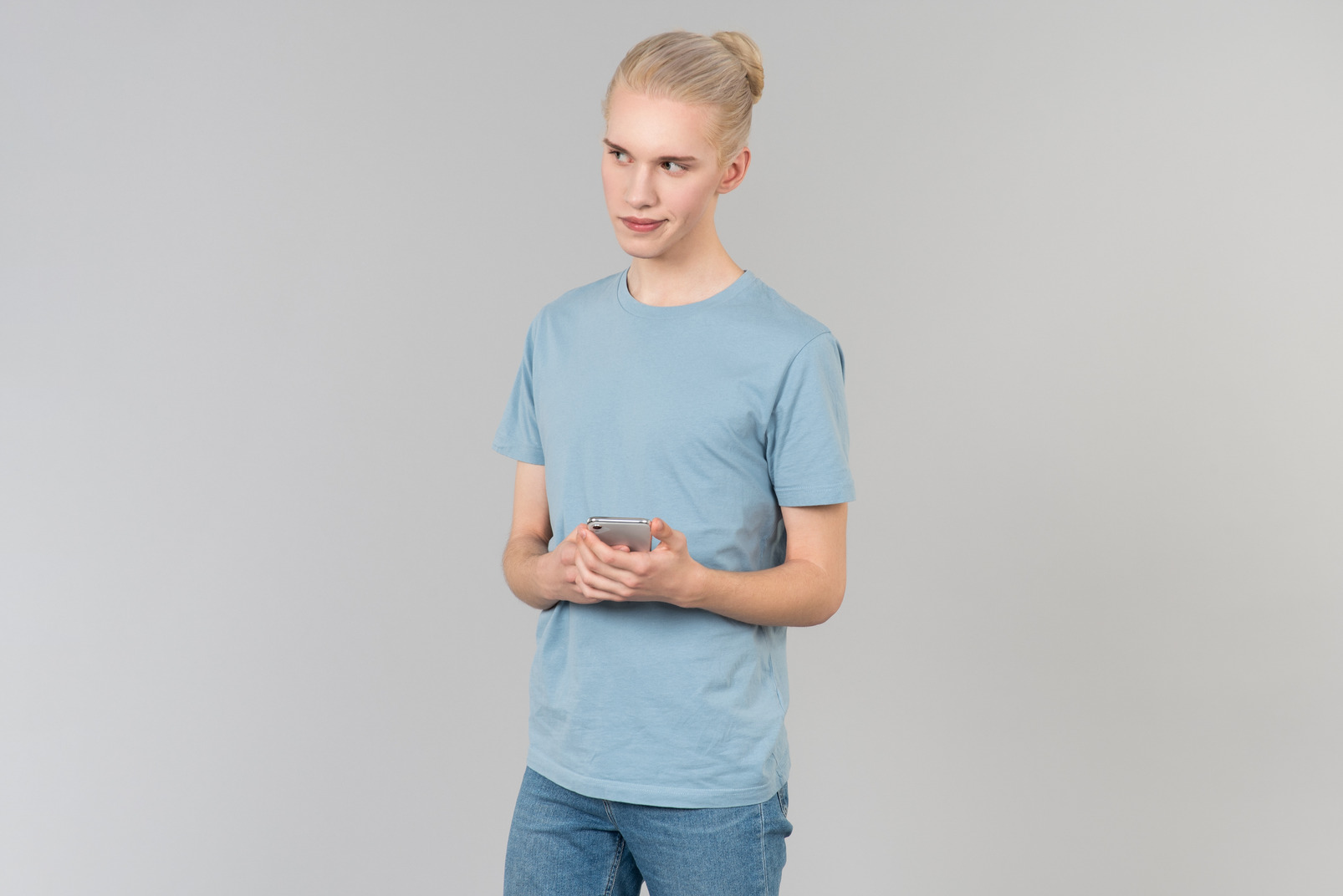 Young guy holding smartphone