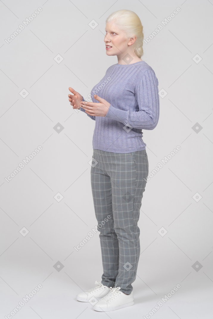 Young woman standing and speaking