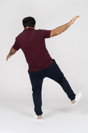 Rear view of a man falling backwards