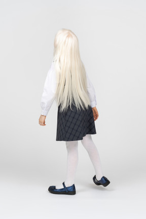 Back view of a long-haired schoolgirl