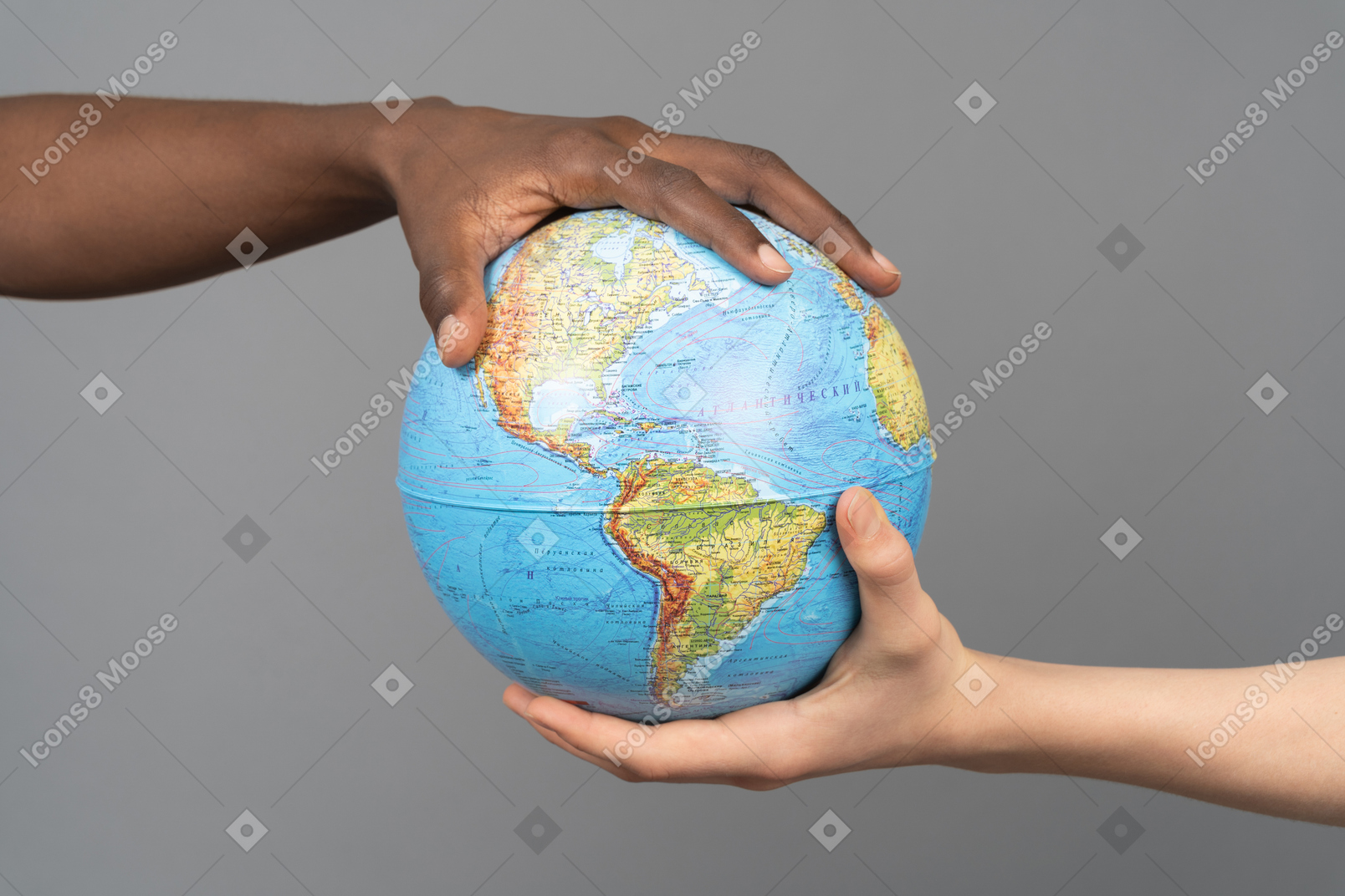 Earth globe in two different hands