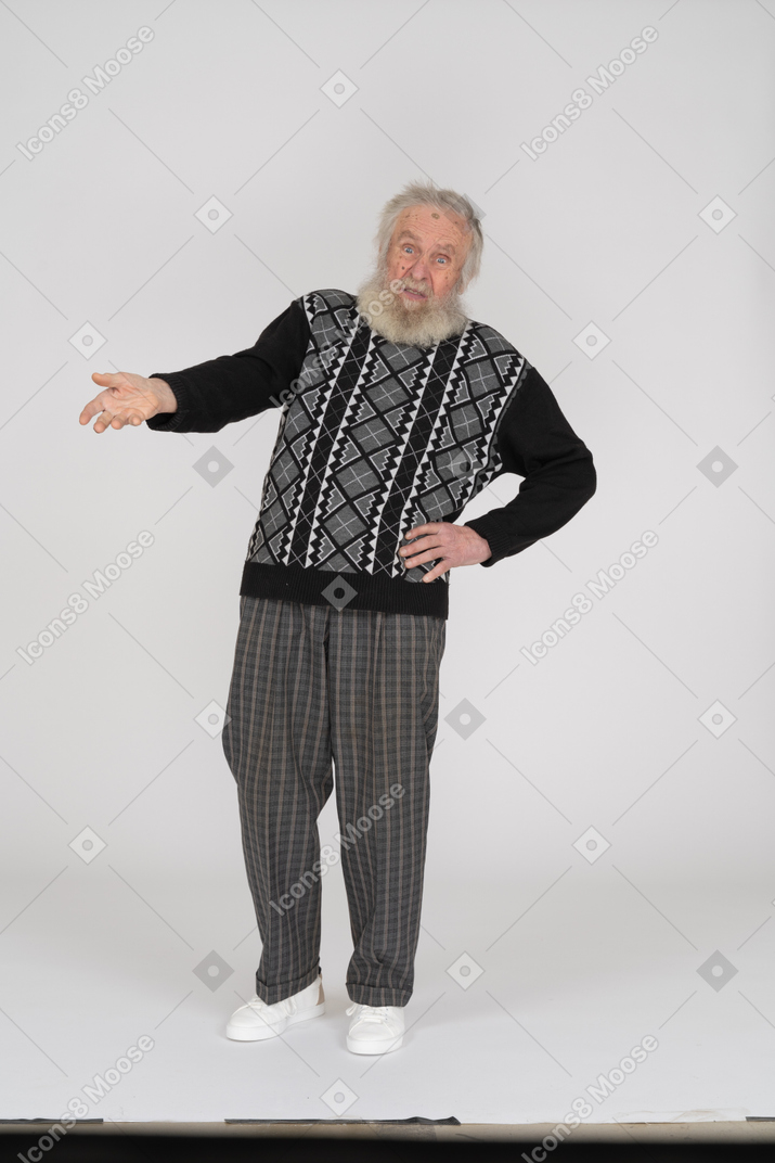 Old man outstretching hand and looking questioned