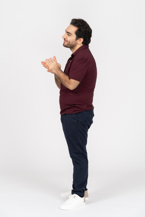 A smiling young man wearing casual clothes