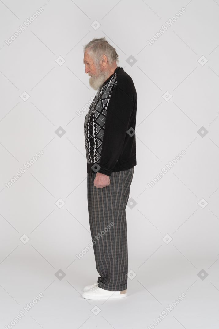 Side view of old man looking down