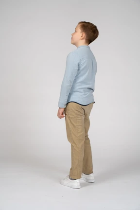 Side view of a cute boy looking up