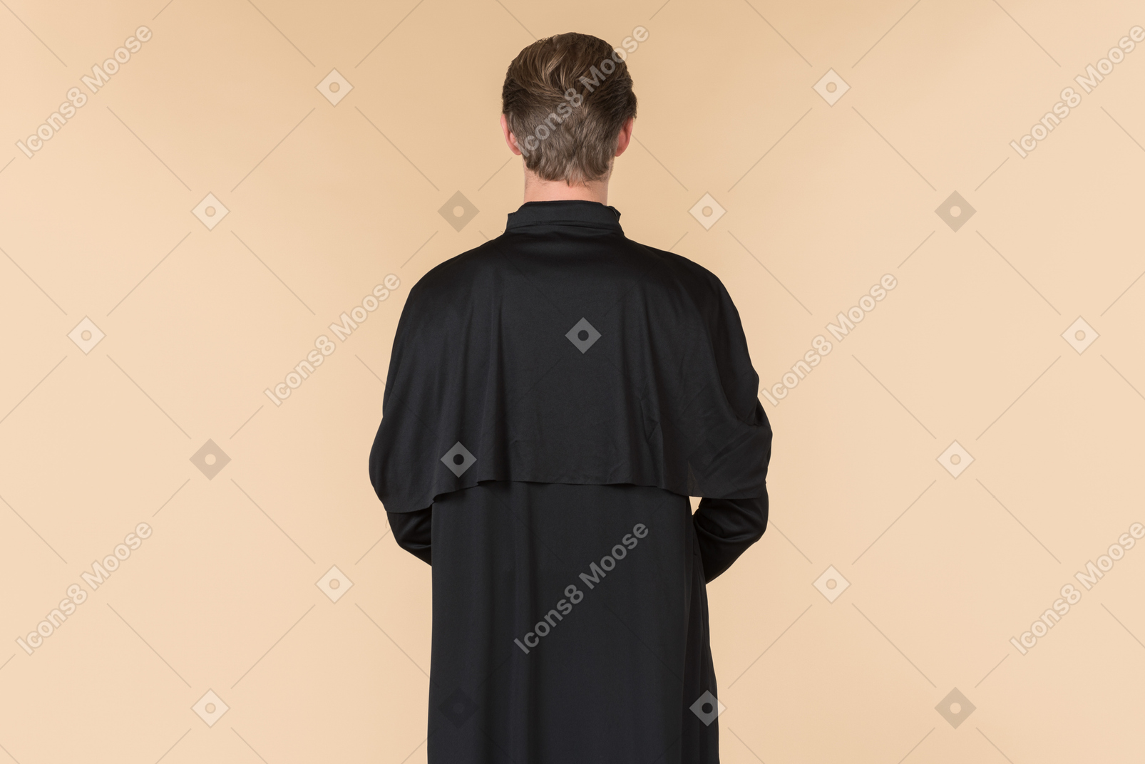 Catholic priest standing back to camera