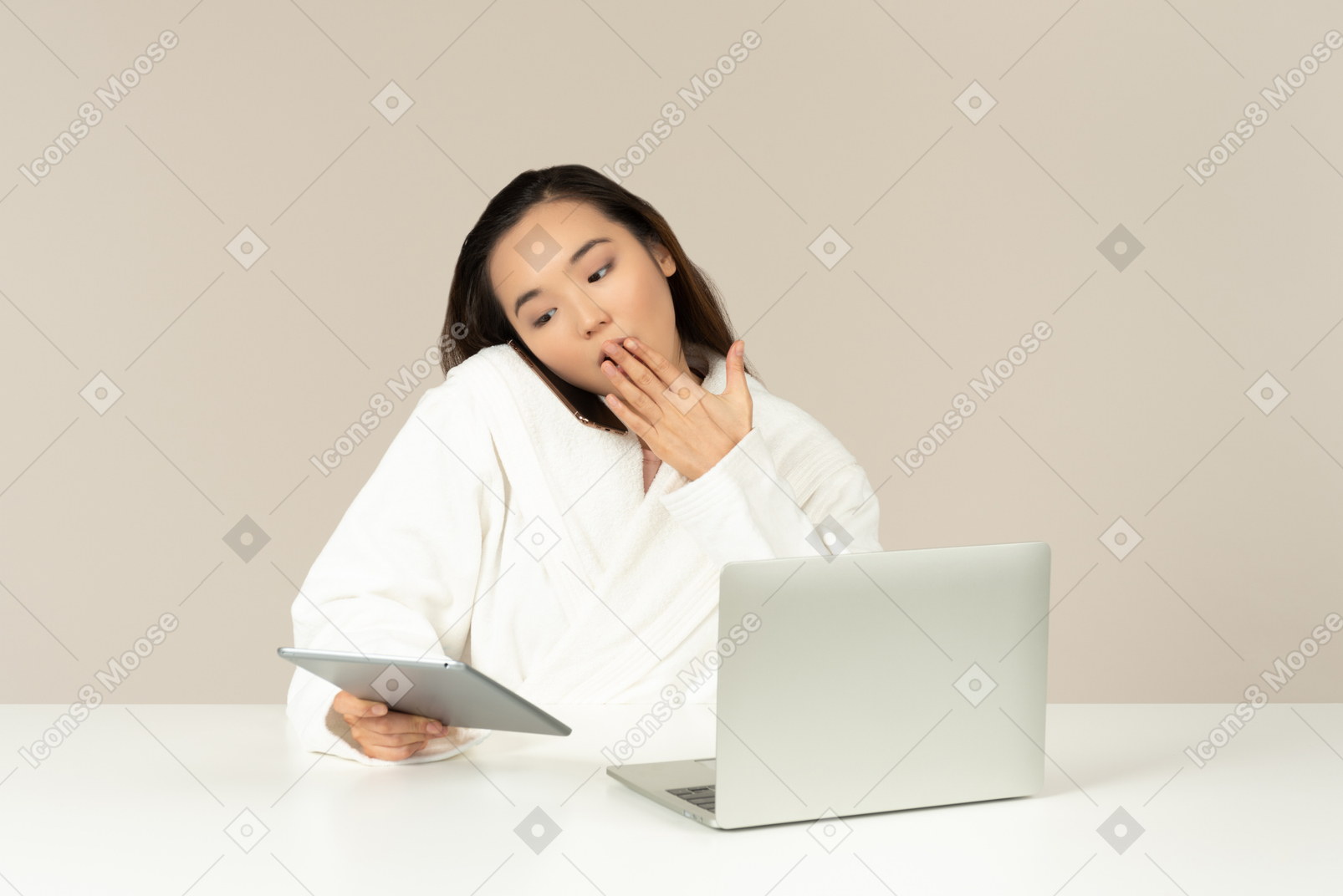 Gasping young asian woman talking on the phone, using tablet and doing online shopping