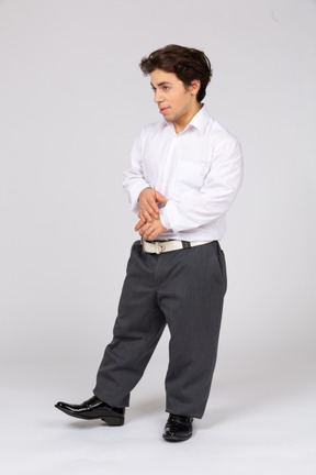 Young man leaning on one leg