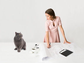 Attractive busy woman and her cat