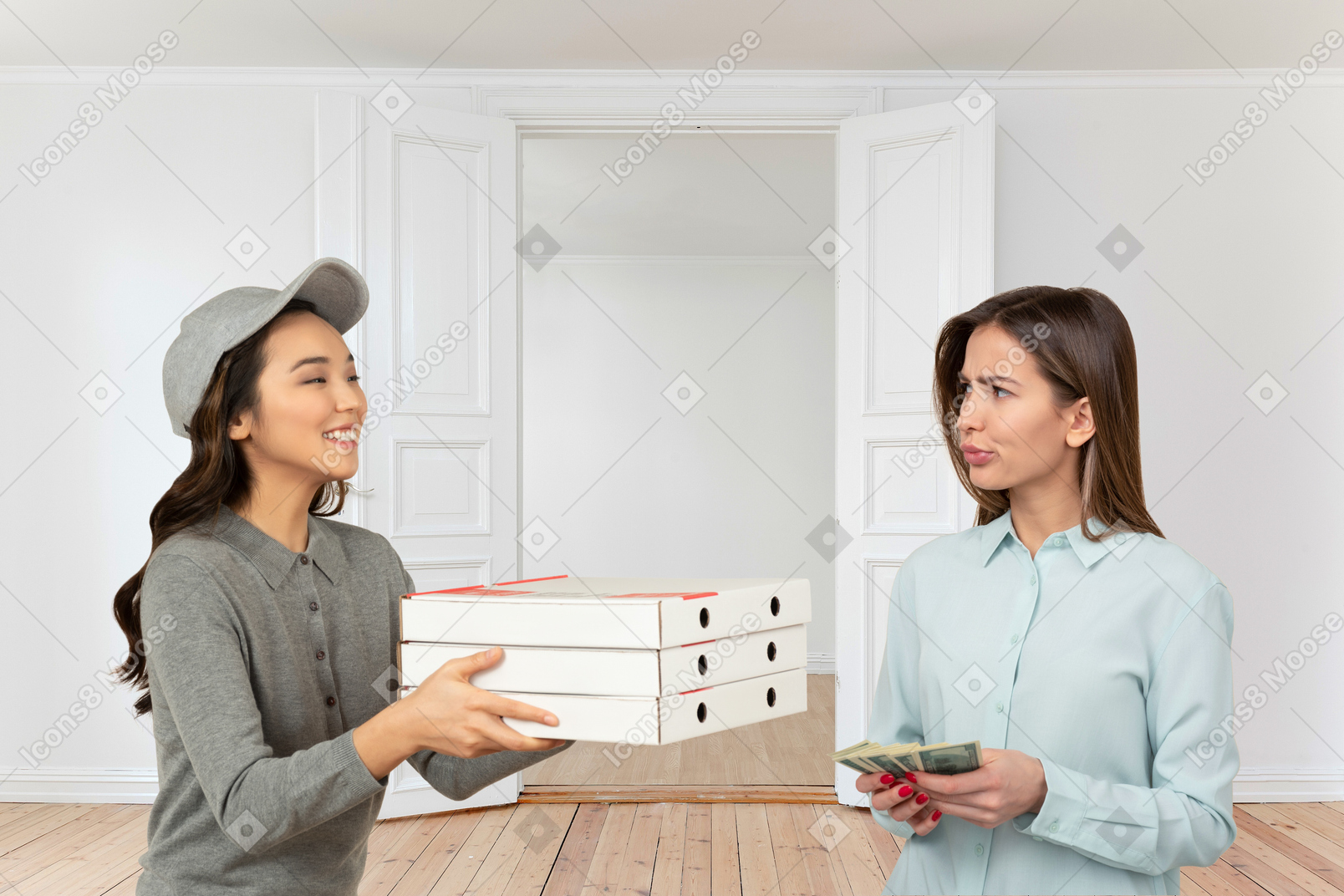 A woman paying for a pizza delivery