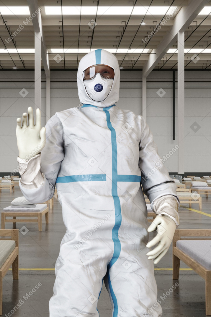 Man in a protective suit standing in a hospital