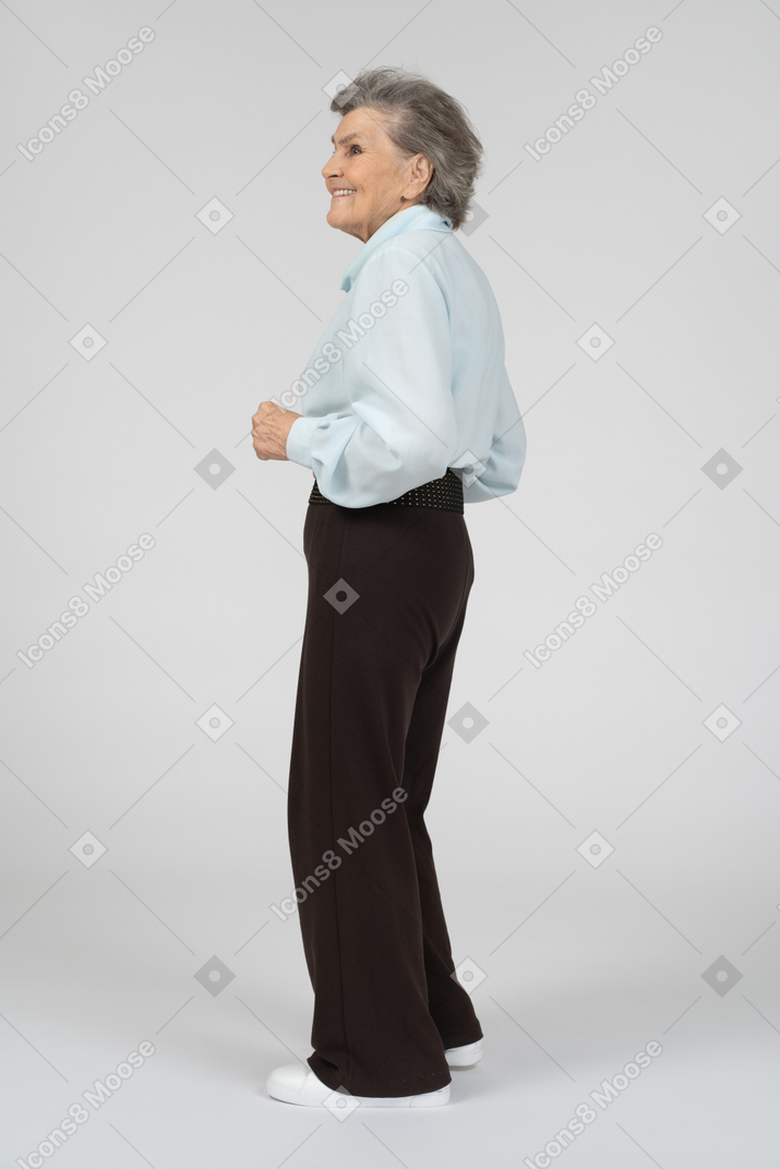 Side view of an old woman looking happy and excited