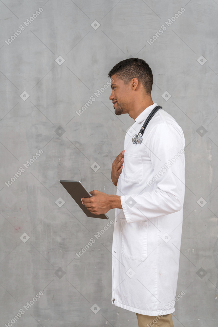 Side view of a male doctor talking