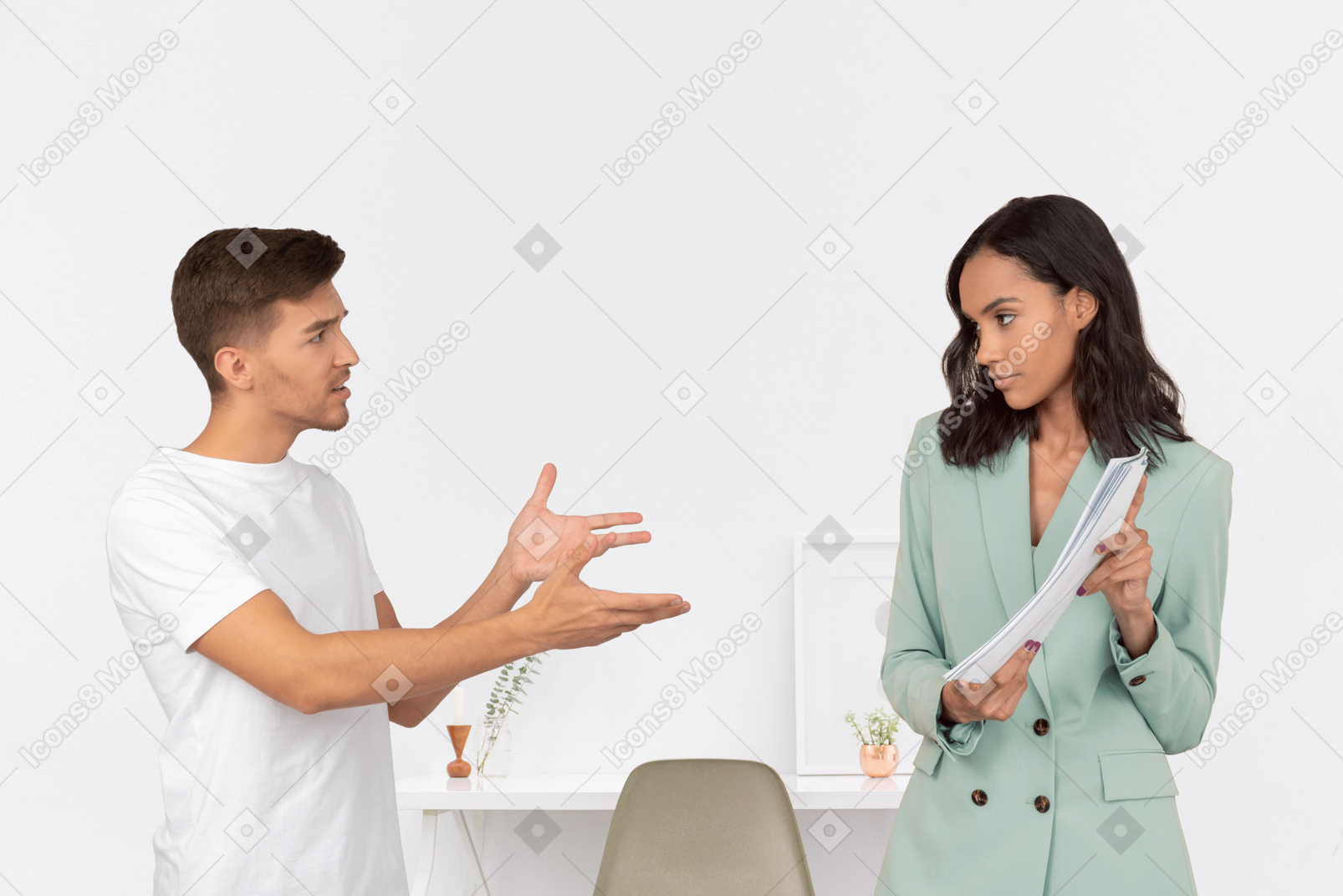 Female boss and male employee figuring out work stuff