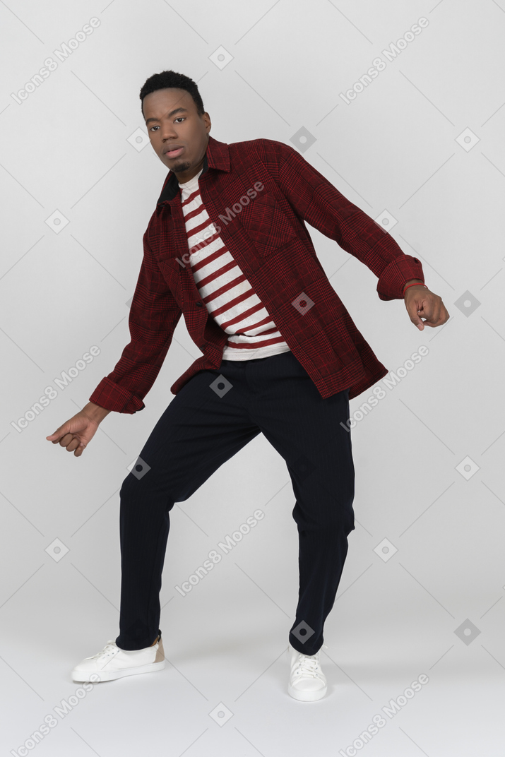 Front view of young black man dancing